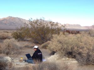 Amargosa Conservancy hydrogeologist Andy Zdon checking well depth at our Twelvemile Spring well in Chicago Valley.